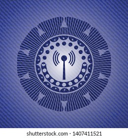 antenna signal icon inside emblem with denim texture