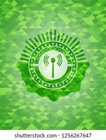 antenna signal icon inside green emblem with mosaic ecological style background