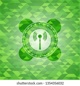 antenna signal icon inside green emblem with mosaic background