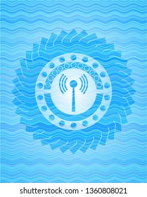 antenna signal icon inside light blue water wave badge.