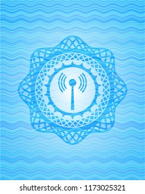 antenna signal icon inside sky blue water wave badge.