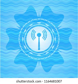 antenna signal icon inside water wave representation badge.
