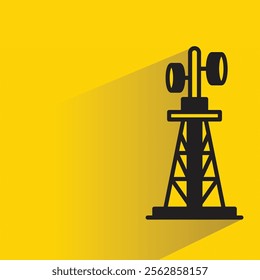 antenna tower with shadow on yellow background