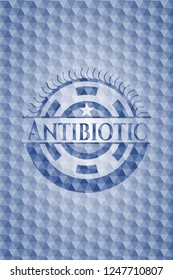 Antibiotic blue emblem with geometric pattern.