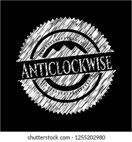 Anticlockwise written on a chalkboard