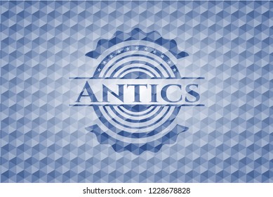 Antics blue badge with geometric background.