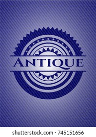 Antique badge with denim background