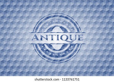 Antique blue badge with geometric pattern.