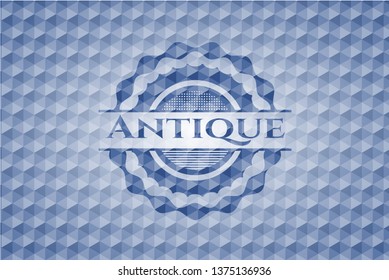 Antique blue emblem with geometric pattern.