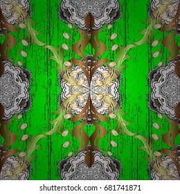 Antique golden repeatable wallpaper.Golden element on green background. Damask pattern repeating background. Golden green floral ornament in baroque style.