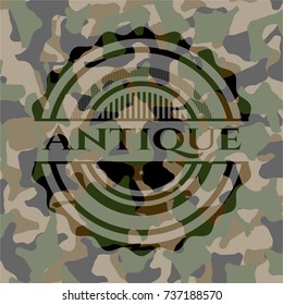 Antique written on a camouflage texture