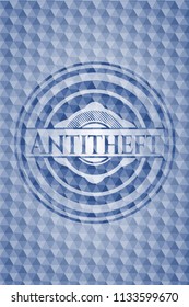Antitheft blue badge with geometric pattern background.