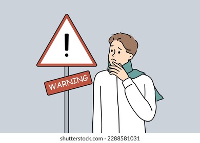 Anxious man standing near warning sign. Worried unhappy guy look at road sign notify alert. Vector illustration. 