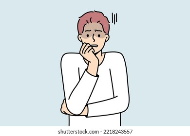 Anxious young man feeling terrified and worried. Unhappy guy feel afraid and astonished. Emotion control and mental problems. Vector illustration. 