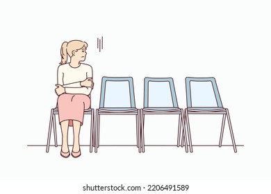 Anxious young woman sit on chair in corridor waiting or appointment. Stressed female feel worried wait in line in hallway. Vector illustration. 