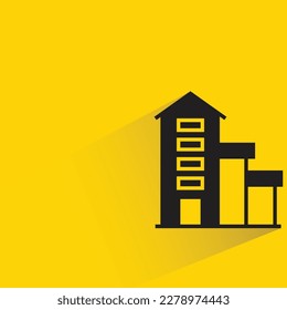 apartment building with shadow on yellow background