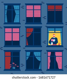 Apartment house at night with empty windows with only one man awake