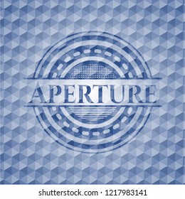 Aperture blue badge with geometric pattern.