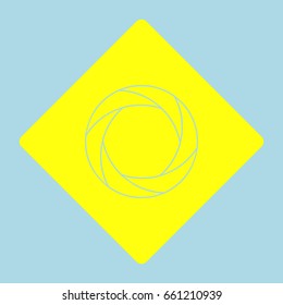 Aperture or Camera objective icon. Vector. Yellow romb with hole as icon on lightblue background.