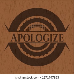 Apologize badge with wooden background