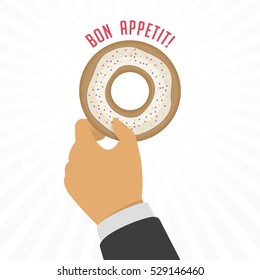 Appetizing tasty donut with white glaze in hand of man. Cream yummy cookie donuts food. 