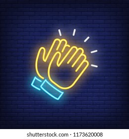 Applause neon icon. Clapping hands on brick wall background. Show concept. Vector illustration can be used for neon signs, advertising, stand up show, concert