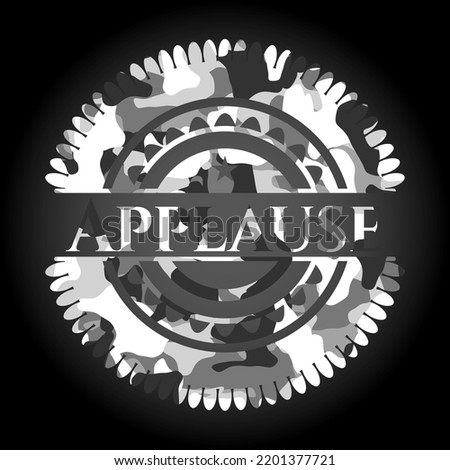 Applause on grey camouflaged texture 