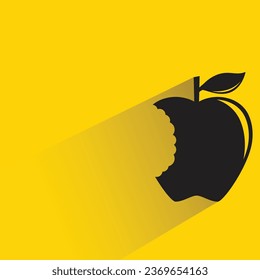 apple bite with shadow on yellow background