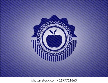 apple icon inside badge with denim background