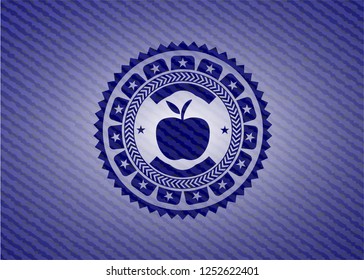 apple icon inside badge with denim background