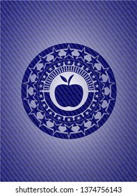 apple icon inside badge with denim background