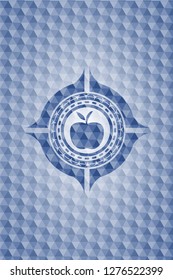 apple icon inside blue badge with geometric pattern.