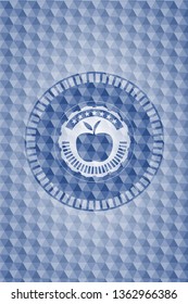 apple icon inside blue badge with geometric pattern.