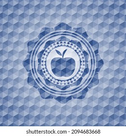 icono de manzana dentro de la placa azul con un patrón geométrico. 