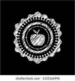 apple icon inside chalkboard emblem on black board
