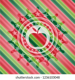 apple icon inside christmas colors style badge.