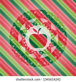 apple icon inside christmas colors style emblem.