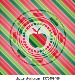 apple icon inside christmas colors badge.