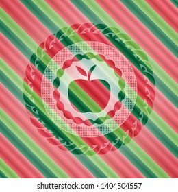 apple icon inside christmas colors badge.
