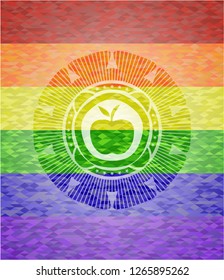 apple icon inside emblem on mosaic background with the colors of the LGBT flag