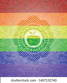 apple icon inside emblem on mosaic background with the colors of the LGBT flag