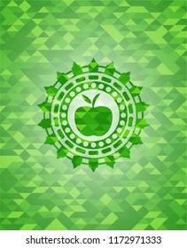 apple icon inside green emblem with triangle mosaic background