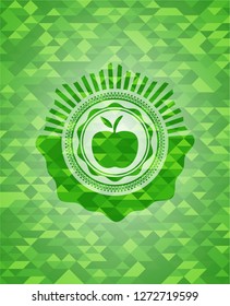 apple icon inside green emblem with mosaic background