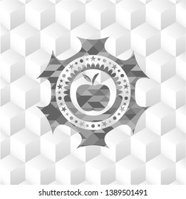 apple icon inside grey badge with geometric cube white background