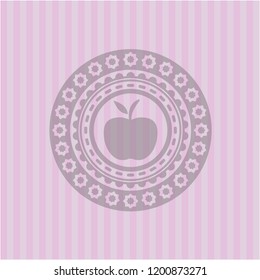 apple icon inside pink emblem