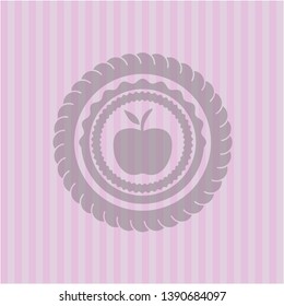 apple icon inside pink emblem