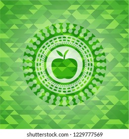 apple icon inside realistic green emblem. Mosaic background