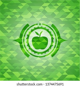 apple icon inside realistic green mosaic emblem