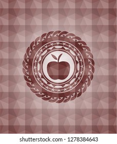 apple icon inside red seamless emblem with geometric pattern background.