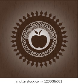 apple icon inside retro style wooden emblem